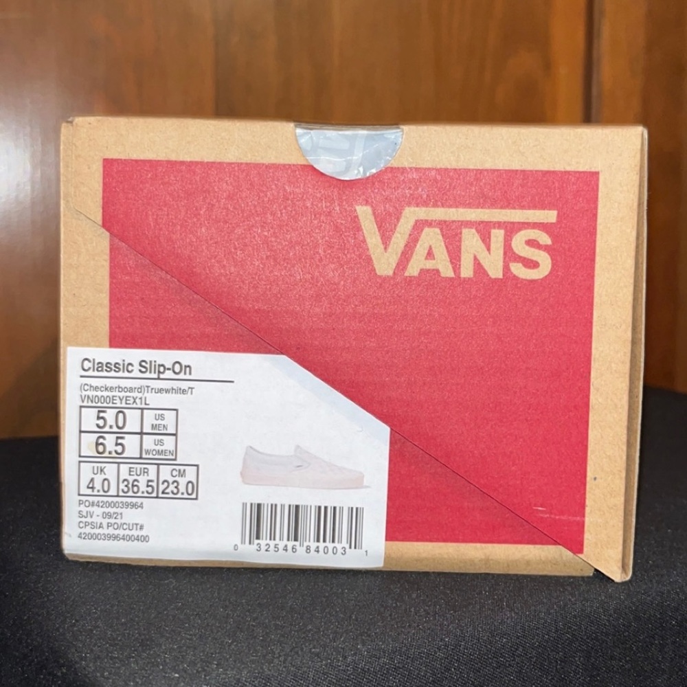 White checkered slip on vans